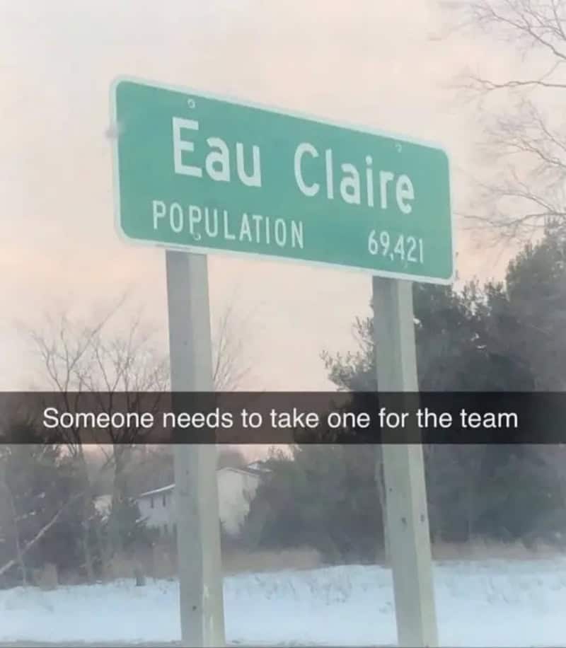 Eau Claire town sign with population 69,421 and a snowy background.