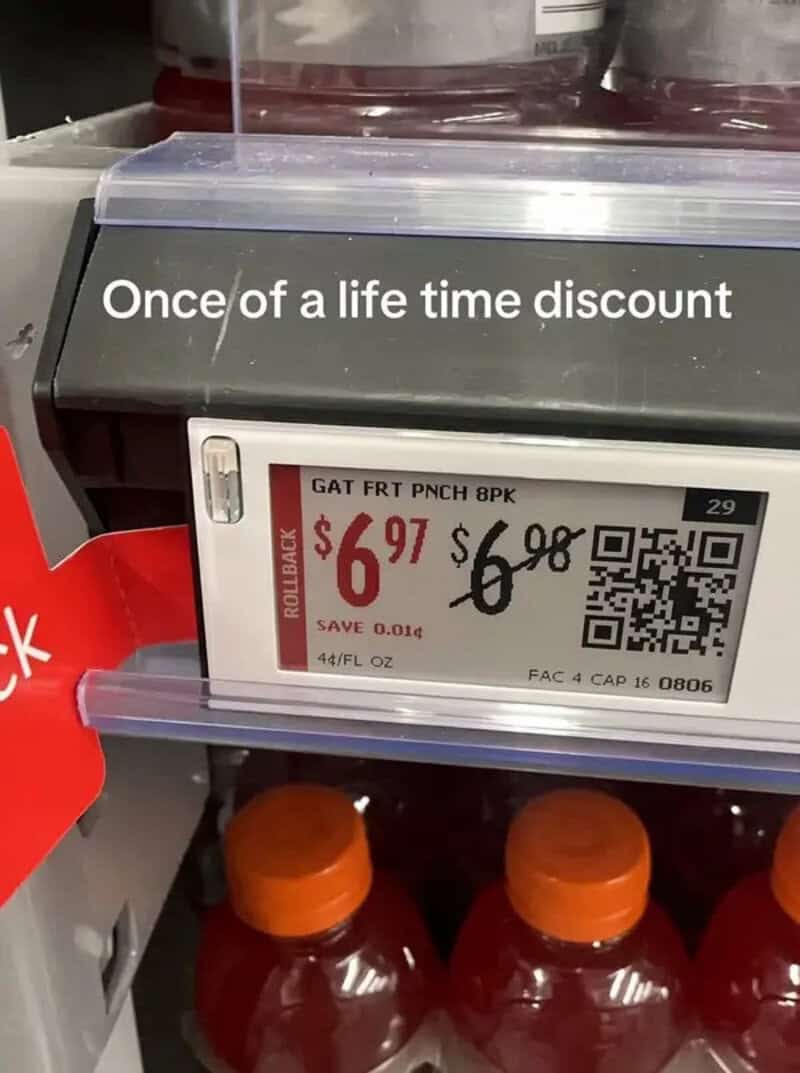Gatorade bottles with a discount price of $6.97, original $6.98, QR code on display.