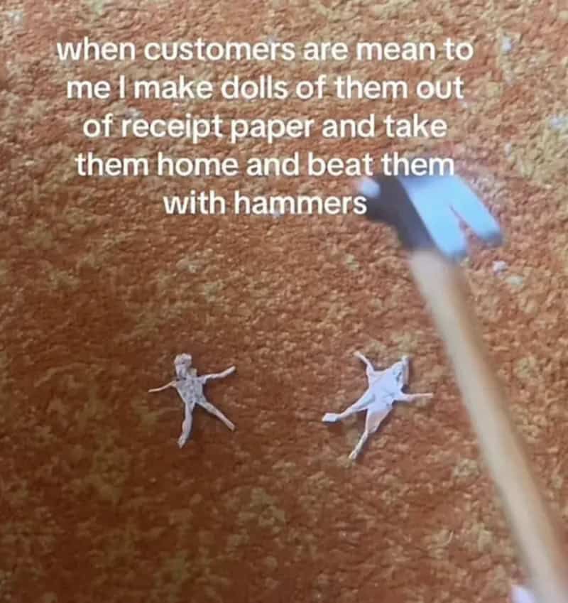 Dolls made from receipt paper on carpet with hammer above them.
