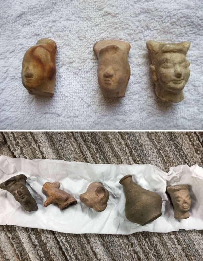 Ancient small clay and stone figurines and heads from old houses.