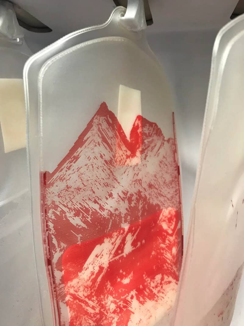 A styrofoam container with a mountain landscape print that looks like a mountain range.