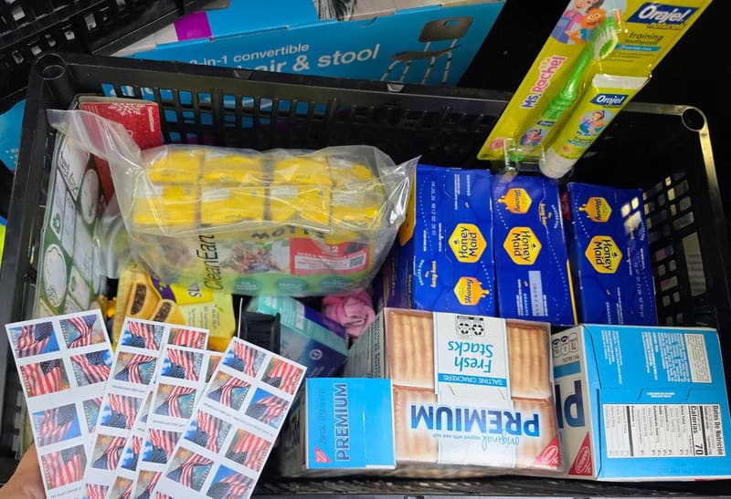 A shopping basket filled with various household items and toiletries.