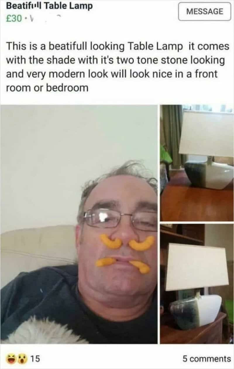 Funny man with a table lamp and a filter adding mustache and nose effects.