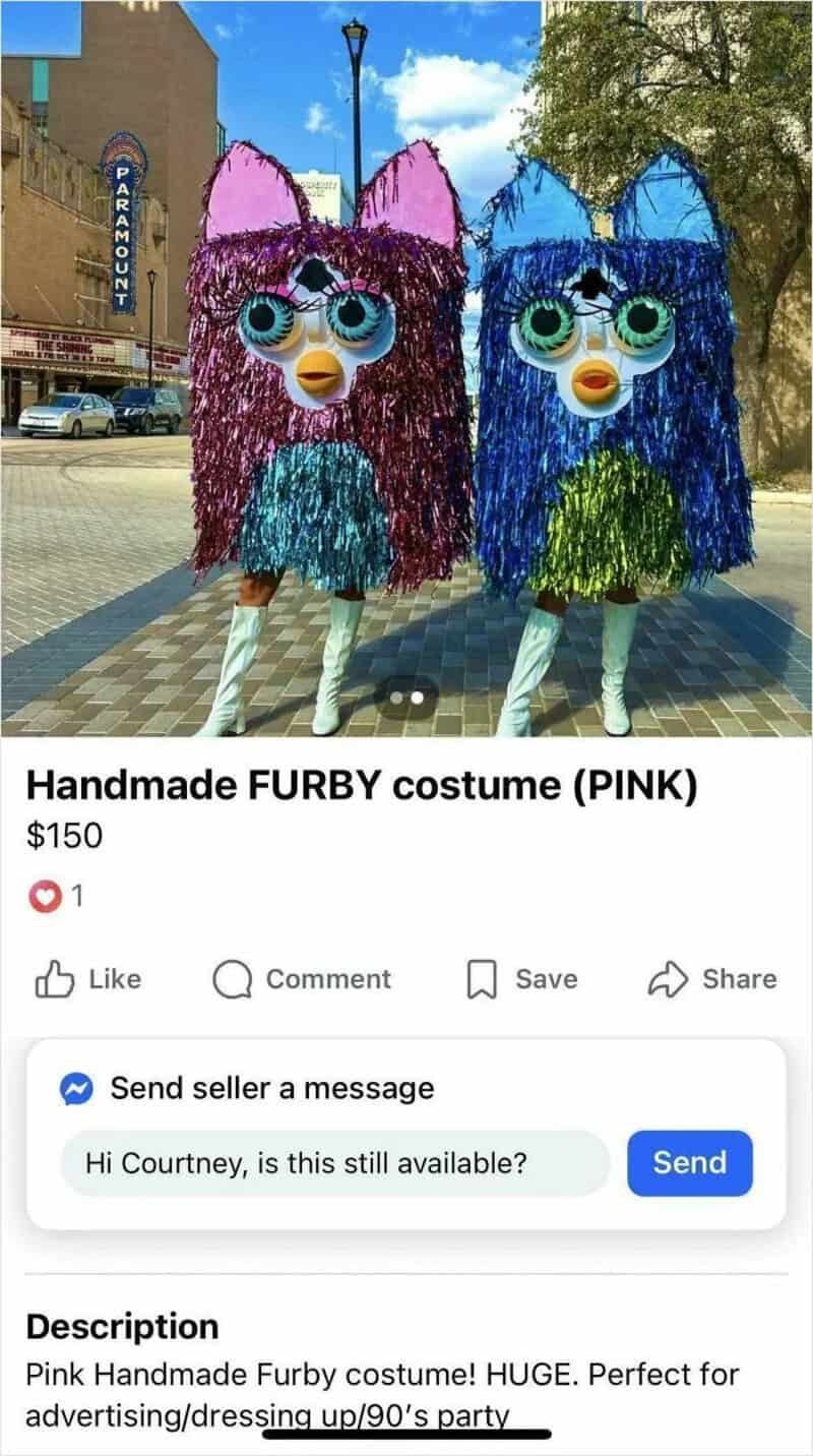 Two people in large, colorful Furby costumes with big eyes and fringed fur, one pink and one blue.