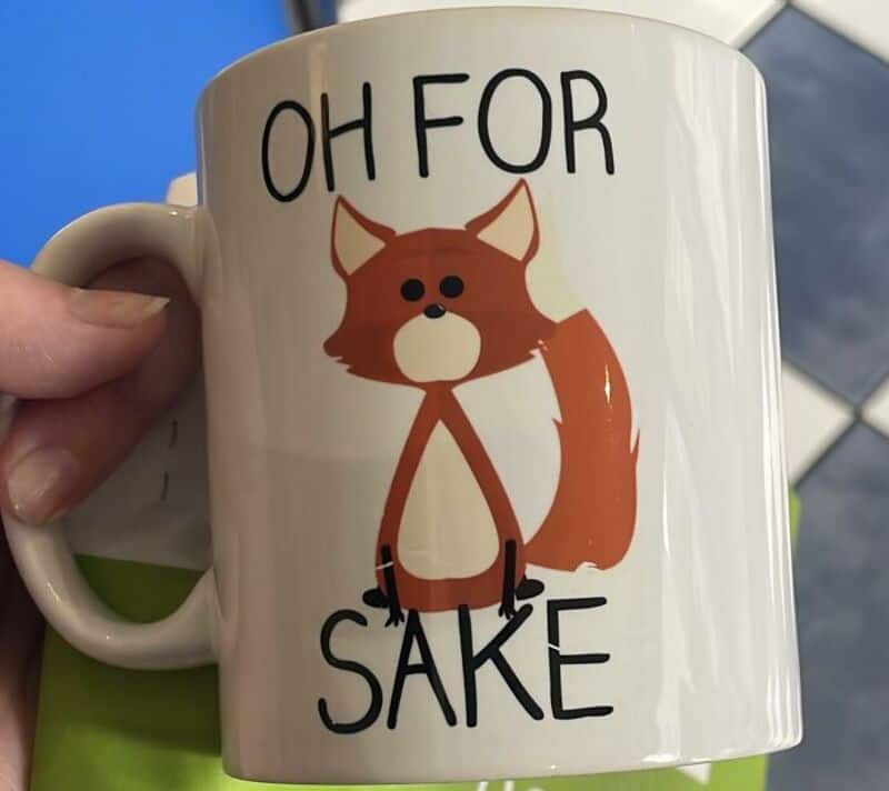 OH FOR SAKE — a mug with a cartoon fox and bold text.
