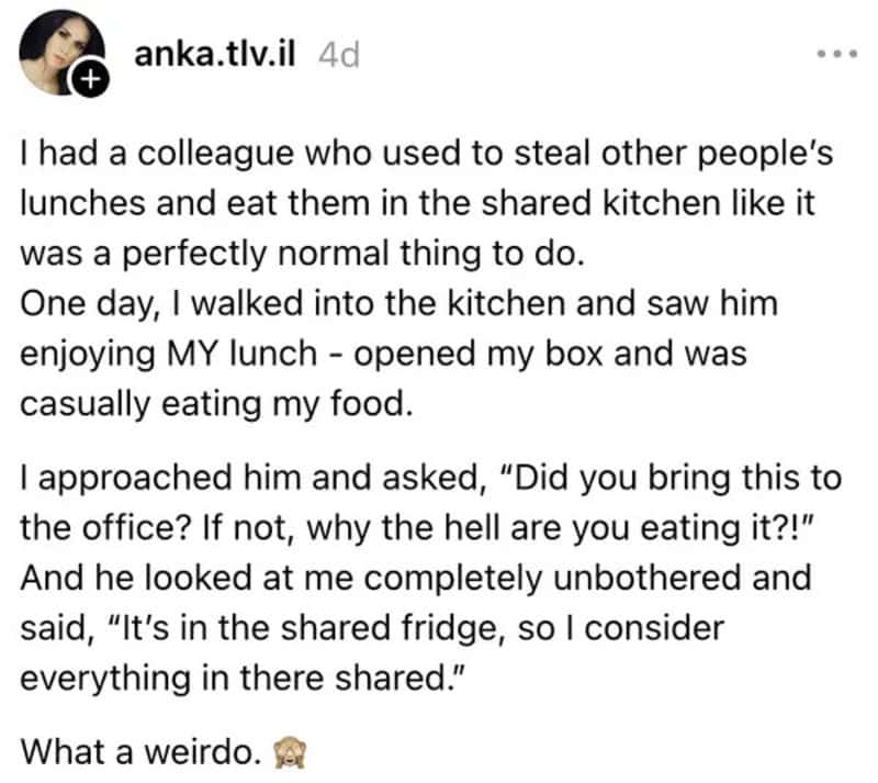 Colleague eating shared lunch from the fridge, casual and unbothered.