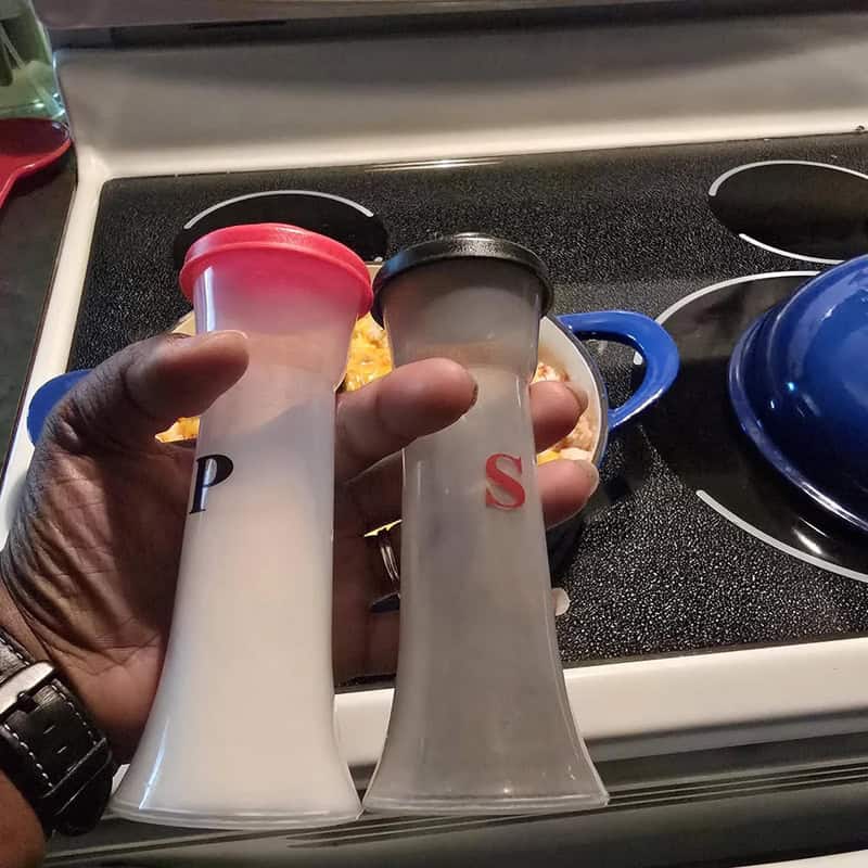Salt and pepper shakers labeled P and S in a kitchen.
